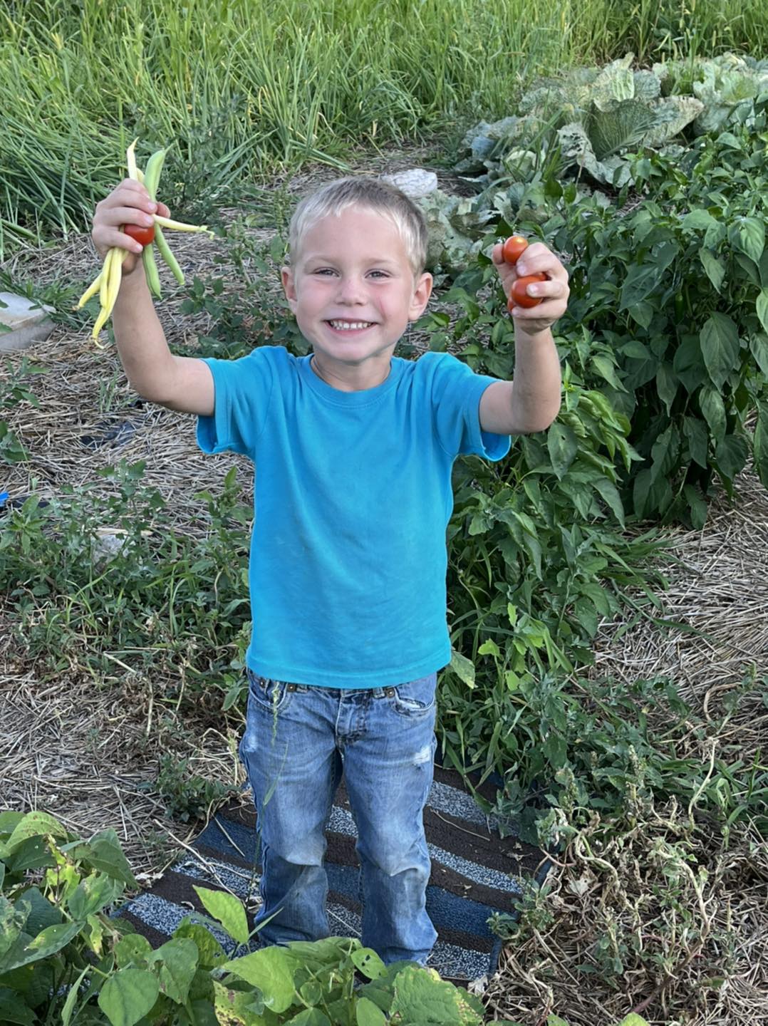 happy farm kid in garden.jpg